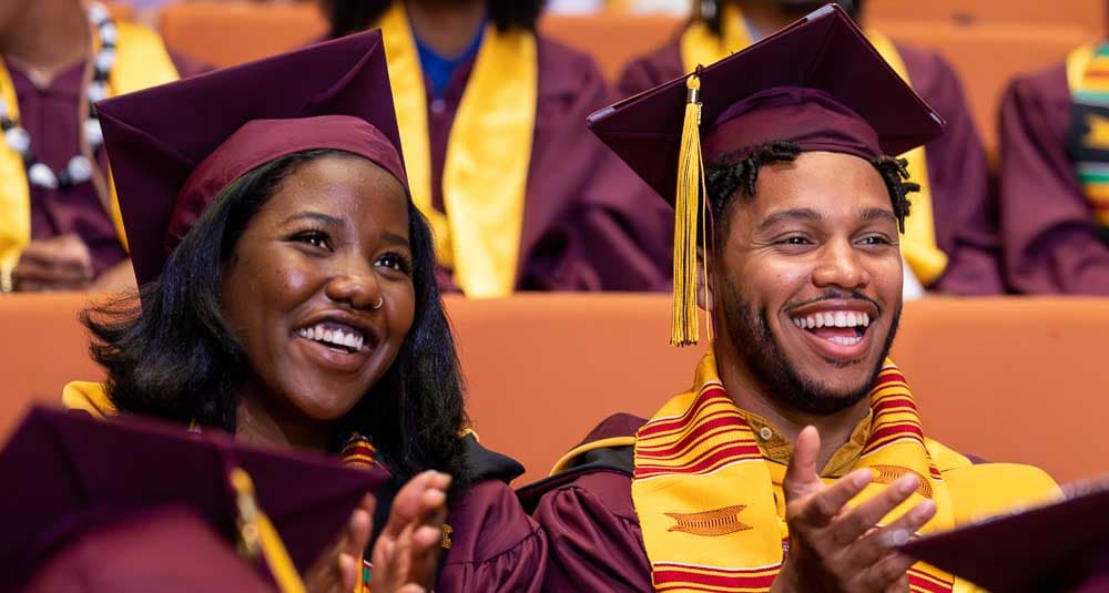 Black ASU graduates celebrating at commencement.
